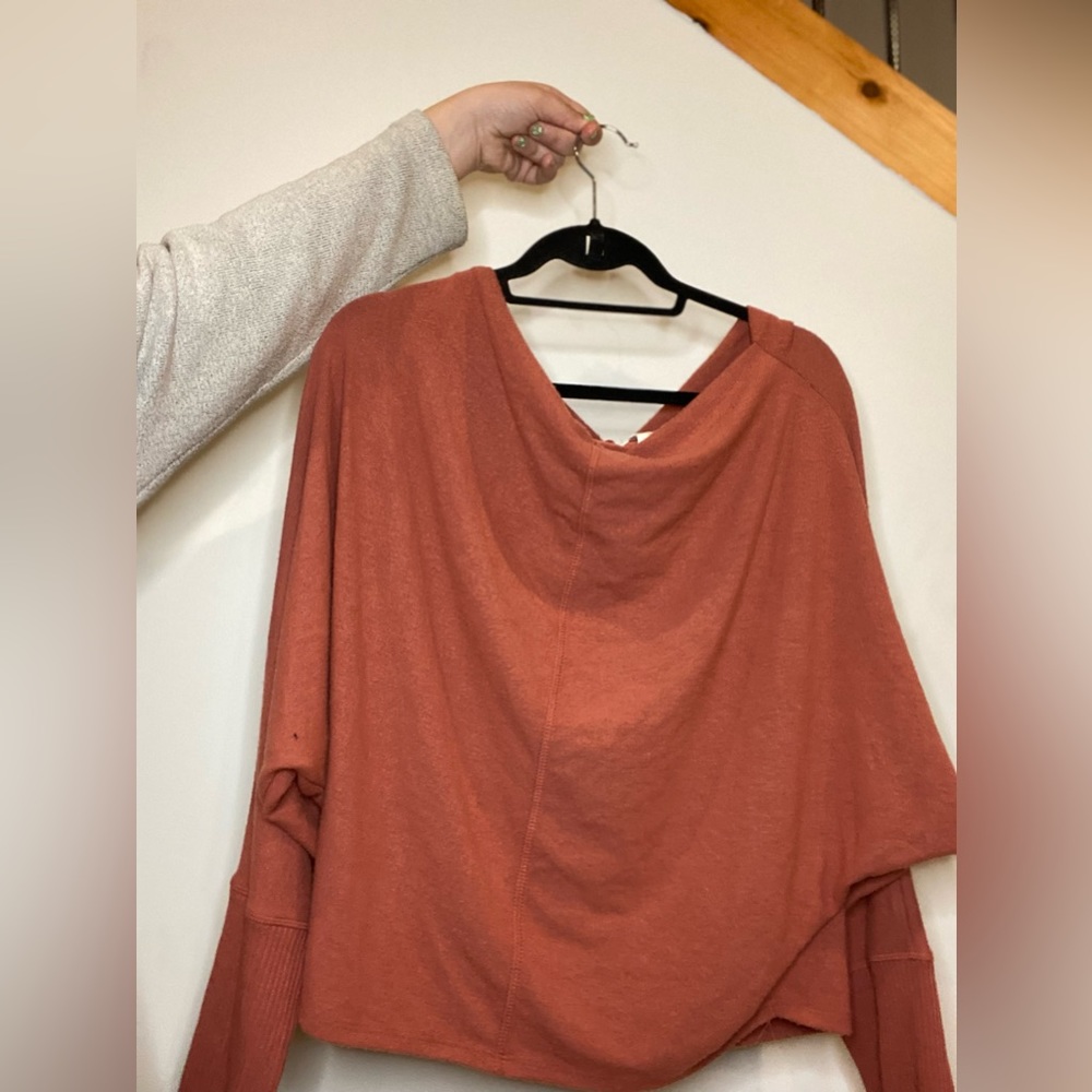 Terra-cotta sweater with a droopy neckline